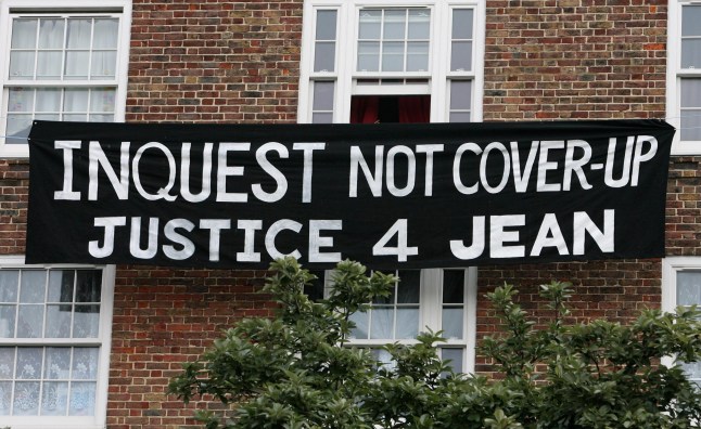 A banner is hung from the windows of flats near to where the inquest into the death of Jean Charles de Menezes starts today at the Brit Oval, Kennington, in south London. PRESS ASSOCIATION Photo. Picture date: Monday September 22, 2008. The inquest, which takes place less than a mile from Stockwell tube station where Jean Charles was shot dead, it is expected to last for 12 weeks. See PA story INQUEST Menezes. Photo credit should read: Johnny Green/PA Wire