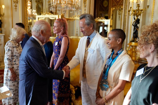 King Charles III speaks with actor Richard E Grant and broadcaster Adele Roberts during a reception in Buckingham Palace, London, in celebration of community-based initiatives raising awareness about cancer and supporting those living with cancer. Picture date: Wednesday April 30, 2025. PA Photo. See PA story ROYAL King. Photo credit should read: Andrew Matthews/PA Wire