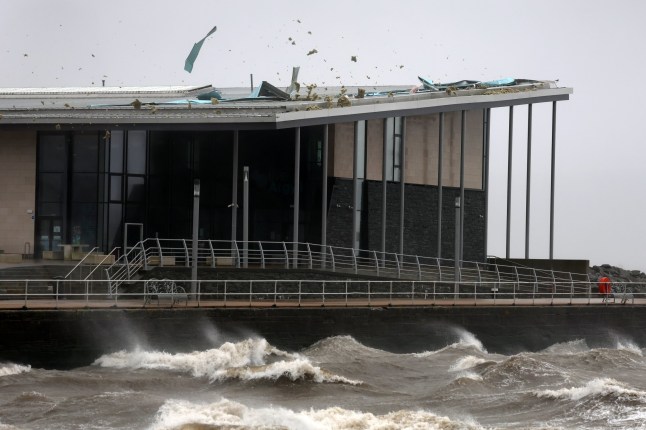 A windy day with waves crashing at HELENSBURGH beach in Scotland.