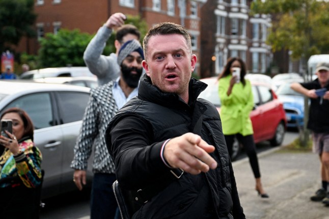 FILE PHOTO: Anti-immigration activist Stephen Yaxley-Lennon, known as Tommy Robinson, gestures before arriving at Folkestone Police Station in Folkestone, Britain, October 25, 2024. REUTERS/Chris J Ratcliffe/File Photo