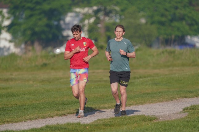 Mandatory Credit: Photo by Amer Ghazzal/Shutterstock (15278394i) Joggers running in the bright morning sunshone on Wimbledon Common, south west London as Thursday is predicted to be the warmest May 1 on record with 30 Celsius /86 Fahrenheit Seasonal Weather, Wimbledon Common, London, United Kingdom - 01 May 2025