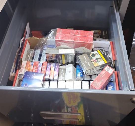 Tourist charged ?899 for two packets of sweets by Oxford Street US-style candy store A record haul of suspected fake goods was uncovered when a tourist complained about being charged ?899 for two packets of sweets in an Oxford Street candy store. Westminster council officials made the discovery when they raided the store with Metropolitan police officers. Two shop assistants fled downstairs and avoided capture by using a secret exit - hidden behind a panel in the basement wall - to escape back up to street level. But they ended up leading officers to discover a hidden room in which thousands of apparently counterfeit goods were discovered.