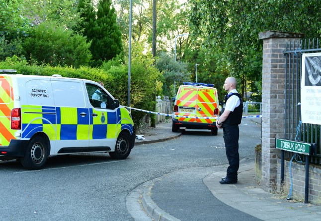 Police cordon off Tobruk Road, Huyton, where a man and woman were stabbed and man subsequently shot by armed officers